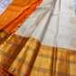 Champa Venpattu — Pure Kanchipuram Handloom Silk Saree
Ivory Champa Body • Marigold-Orange Zari Borders
Heirloom Silk · Temple-Ready Elegance