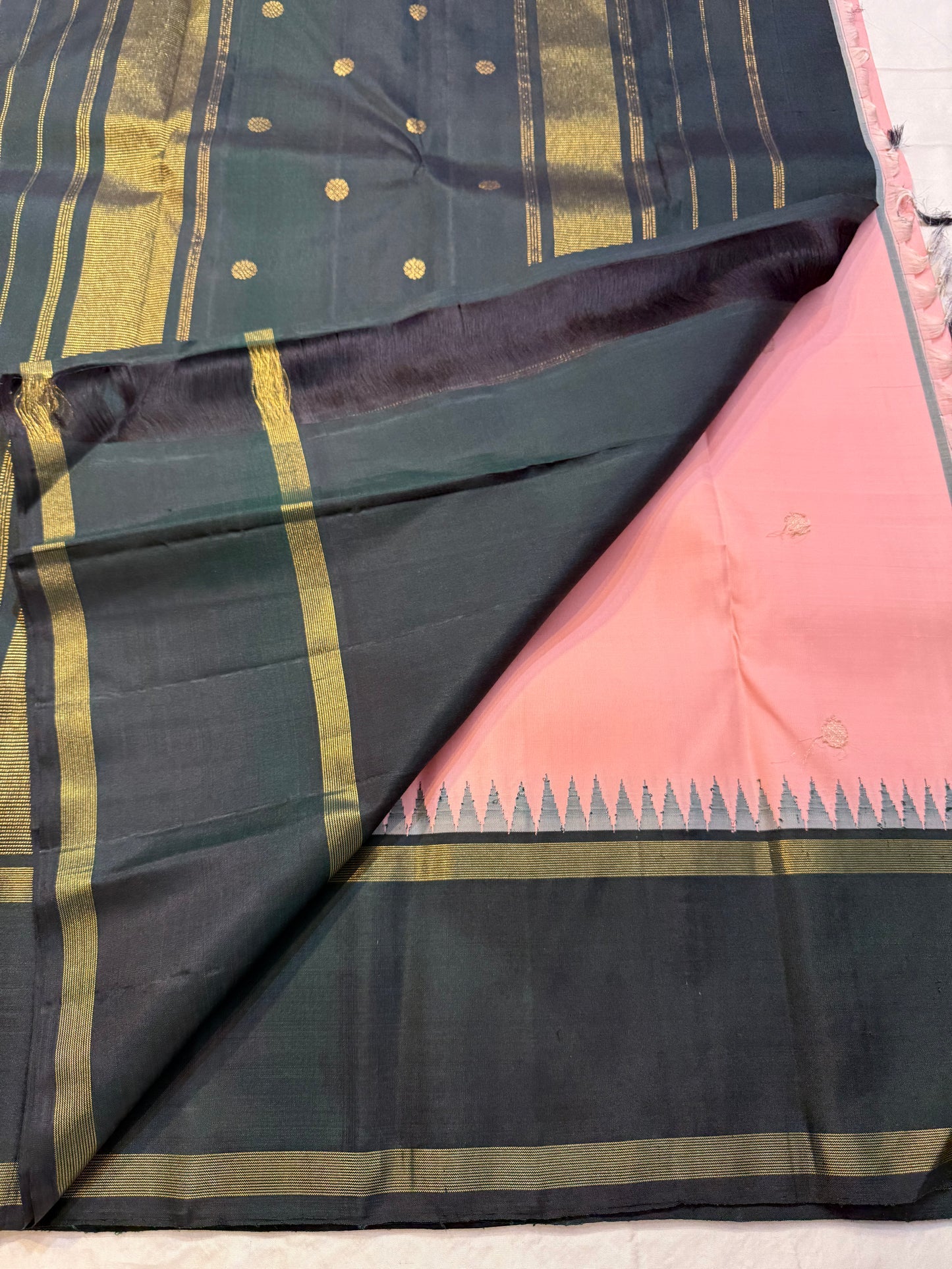 Peach Pastel Pink Pillayar Moggu green korvai Kanchipuram Pure Silk


Soft peach-pink body with delicate gold pillayar moggu & buttas

Contrast deep green pallu with rich zari stripes & coin buttas 

Silk mark , free shipping (USA)  two weeks