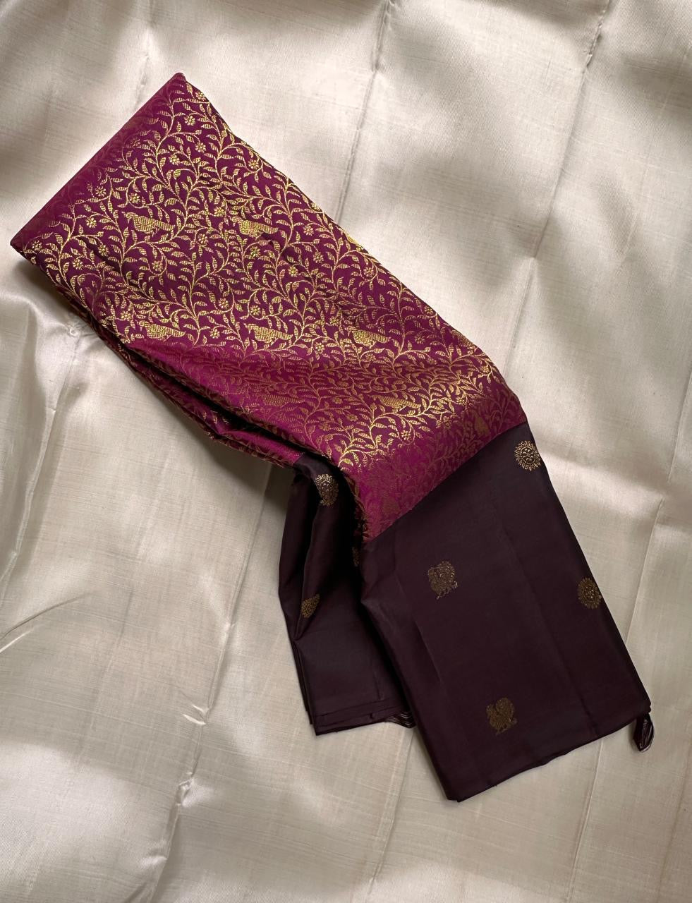 Kavithanjali Plum – Pure Kanchipuram Silk Saree
Plum Body with Gold Floral Zari Buttas & Rich Meenakari Border
Silk Mark Certified • Free Shipping within USA • Ships in Two Weeks