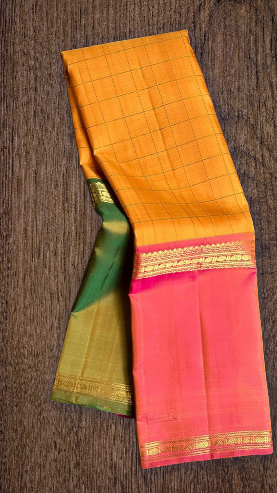 Kesari Checks — Pure Silk Kanchipuram Saree (almost -Mubbagam)
Saffron yellow body in grid kattam weave with radiant pink borders and zari detailing
Silk Mark Certified ✅ • Free USA Shipping • Ships in Two Weeks