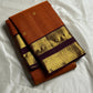 Rust Orange Kattam Rettapet – Pure Silk Kanchipuram Saree
Rust Orange Body with Petite Gold Buttas & Fine Kattam Grid
Deep Aubergine Rettapet Korvai Double-Line Contrast Border
Rich Zari Diamond & Chevron Brocade Pallu
Comes with Contrast Aubergine Blouse