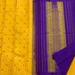 Manjal Vadamalli Chakram – Pure Kanchipuram Silk Saree

Marigold yellow body with purple floral thread buttas

Grand royal purple pallu with gold medallion zari & reku-style stripes

Handwoven Double Warp Weave | Silk Mark Certified | Fall & Pico Done