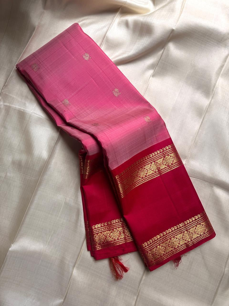 Pure silk kanchipuram rose pink color body with zari mayil chakram  buttas , raspberry pink  border with ornate Pallu