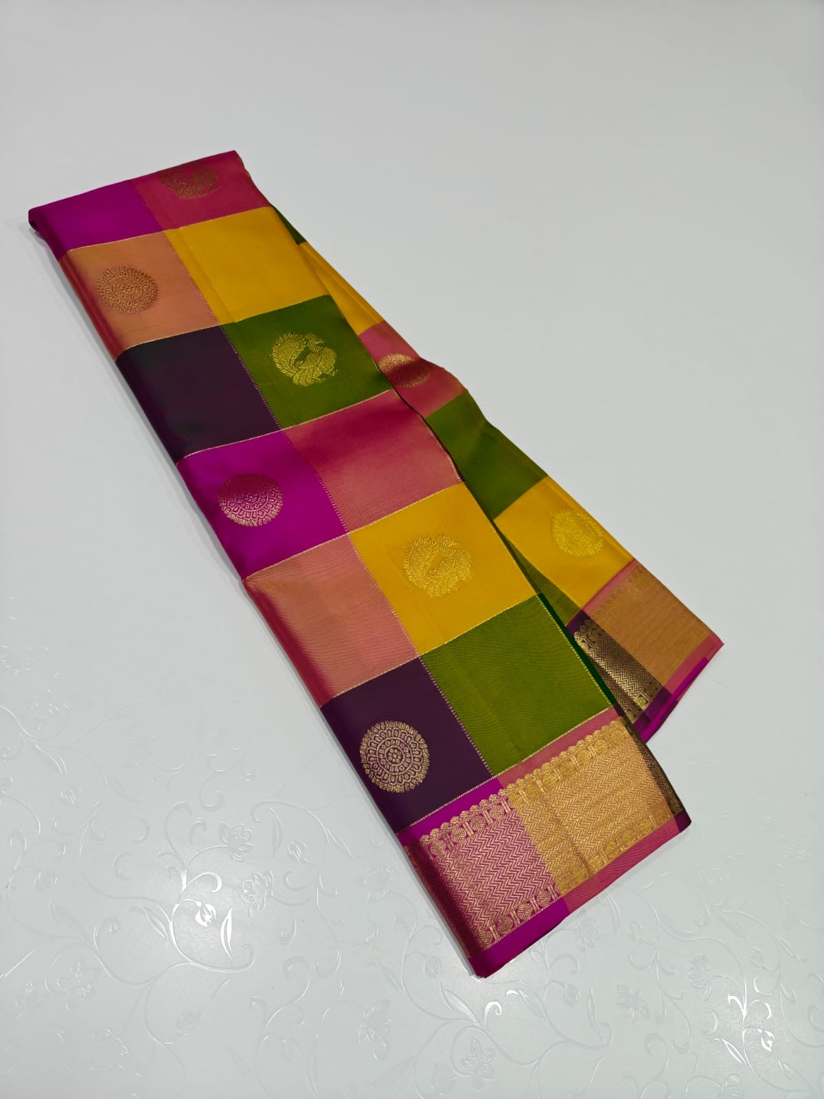 Navaratnam Paalum Palamum ✨ – Pure Kanchipuram Silk Saree
Multi-Color Kattam with Zari Mandala Buttas
Rani Magenta Korvai Border & Grand Zari Brocade Pallu
Contrast Rani Magenta Blouse with Matching Zari Border
Silk Mark Certified ✅ | Ships in 2 weeks