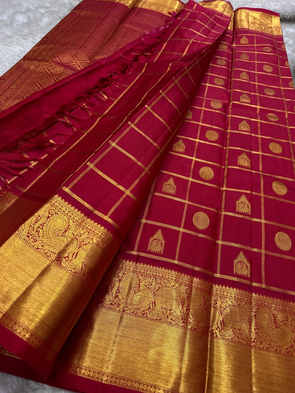 Leelavati Kattam Red
Kumkum-Red Kanchipuram Silk Saree
Zari Kattam Checks & Elephant Procession Border