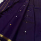 Full layout of purple Kanchipuram silk saree with evenly spaced gold buttas and simple zari pallu and border.