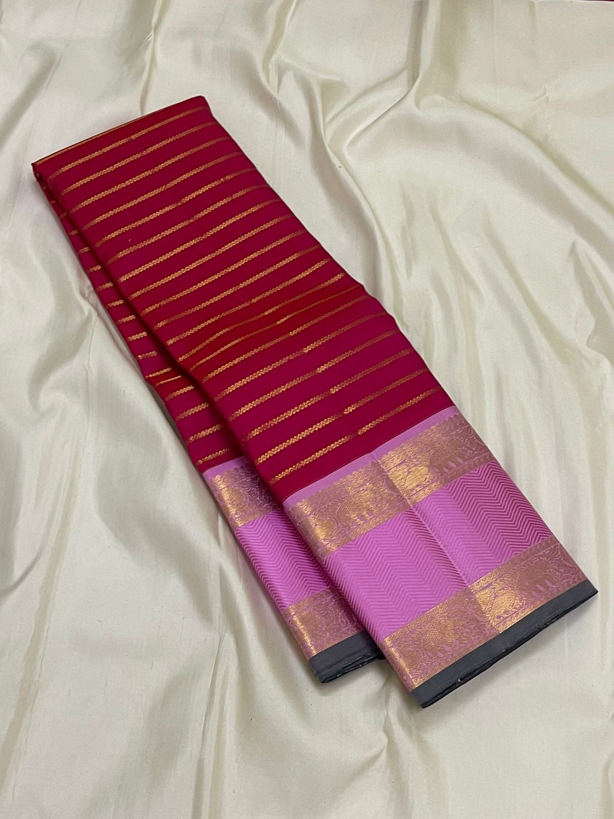 Peony Sringara Velthari — Pure Kanchipuram Silk Saree
Rani magenta body with gold velthari stripes and peony-pink chevron zari border
Silk Mark Certified • Free Shipping within USA • Ships in Two Weeks ✅