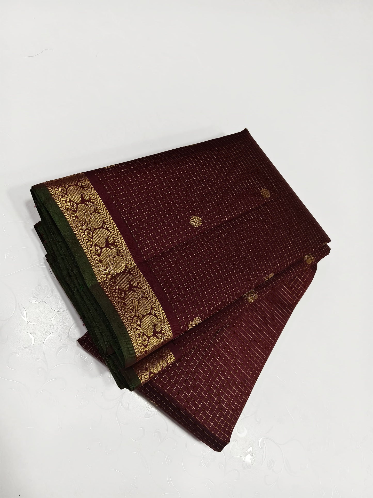 Coffee brown Zari kattam with paisley peacock border kamalam butta and green selvedge , kilo kanjivaram Pallu in pure silk