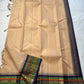 Sandal Temple – Pure Silk Kanchipuram Saree
Sandal Body with mild sheen , pillayar moggu   ✨
Indigo-Purple Korvai Border with Green & Ochre Stripes
Temple Gopuram Zari Edging & Grand Brocade Pallu
Silk Mark Certified | ships in two weeks