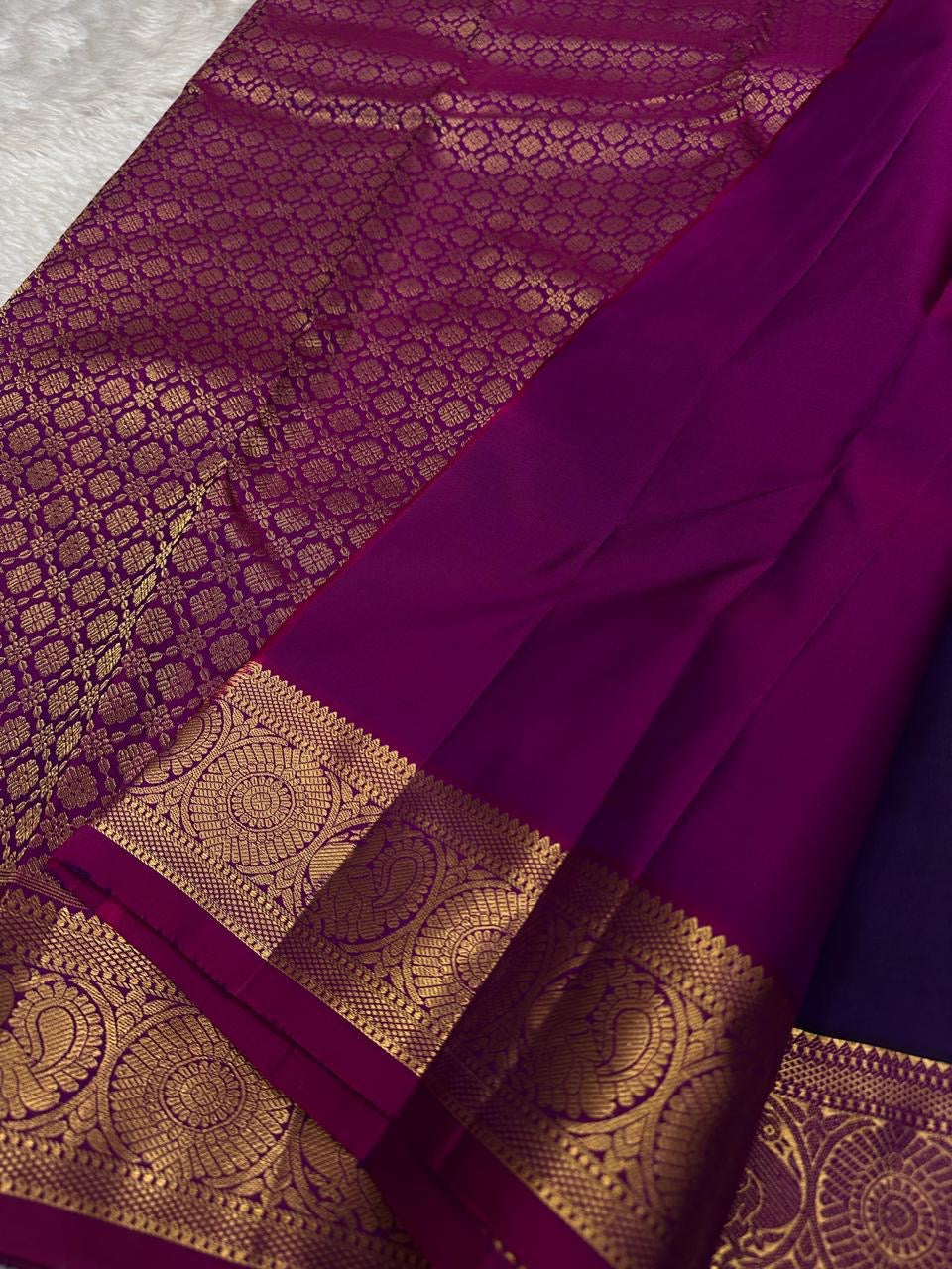 Berry Ruby Kamalam Butta — Pure Kanchipuram Silk
Lotus zari buttas on deep ruby silk with rani korvai border
Silk Mark Certified • Free Shipping within USA • Ships in Two Weeks