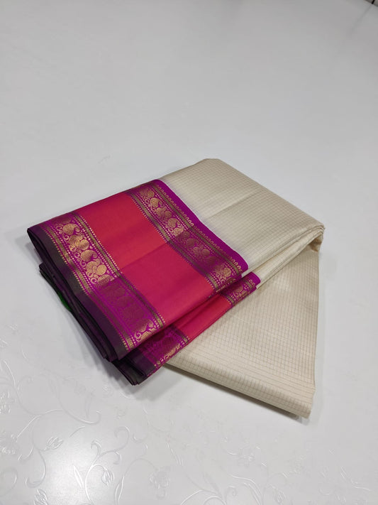 Pearl Lattice – Pure Kanchipuram Silk Saree
Ivory Cream Body with Micro-Checks ✨
Rani-Pink Rettapet Border with Gold Zari
Grand Rani-Pink Brocade Pallu with Traditional Motifs

Silk Mark Certified, delivery in 2 weeks
