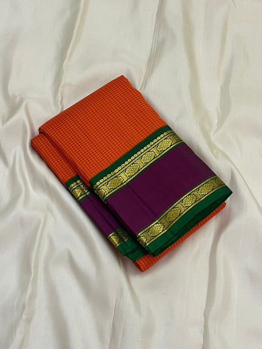 Sunset Kattam — Pure Kanchipuram Silk Saree
Sunset-orange kattam body with royal purple borders and emerald green pallu in fine zari.
Silk Mark Certified • Free Shipping within USA • Ships in Two Weeks