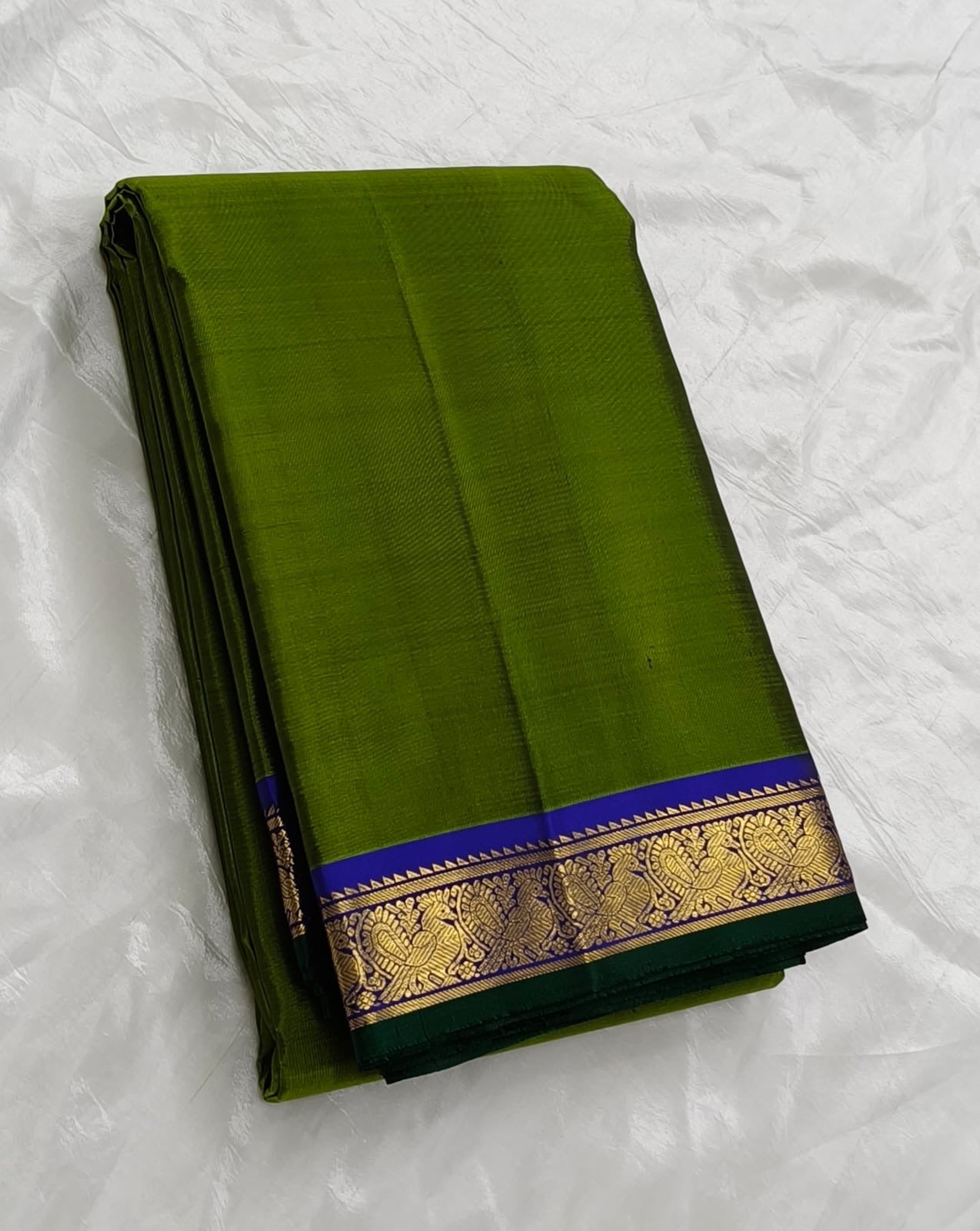 Pure silk Kanjivaram saree in temple olive green with traditional zari detailing – close up