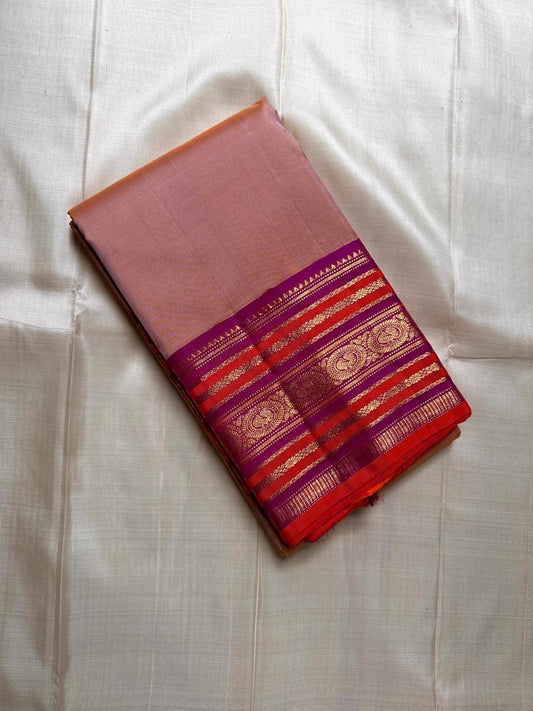 Valli – Handwoven Terracotta Blush Kanchipuram Silk Saree Featuring Intricate Mayil Butta and a Dual-Tone Varisaipet Border in Plum and Vermilion, Adorned with Temple-Inspired Zari motifs