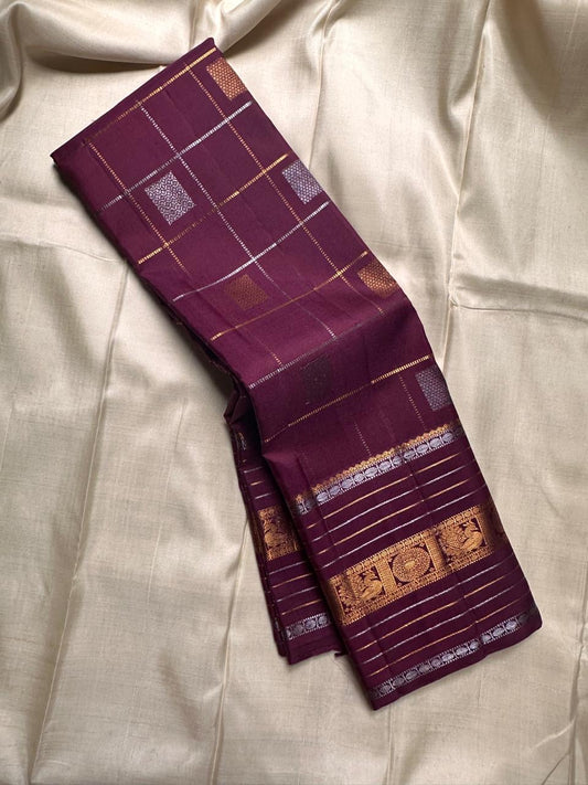 Pankajam 🌺 — a brown-purple jamun Kanchipuram silk saree woven with silver & gold zari kattam, delicate kolam motifs, and a deep magenta-purple selvedge. The Sona Roopa pallu shimmers with ornate grids and intricate motif