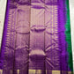 Sunanda – Royal Purple Pure Kanchipuram Silk Saree with Zari Checked Buttas & Majestic Sorgavaasal Mayil Peacock Medallion Temple Border