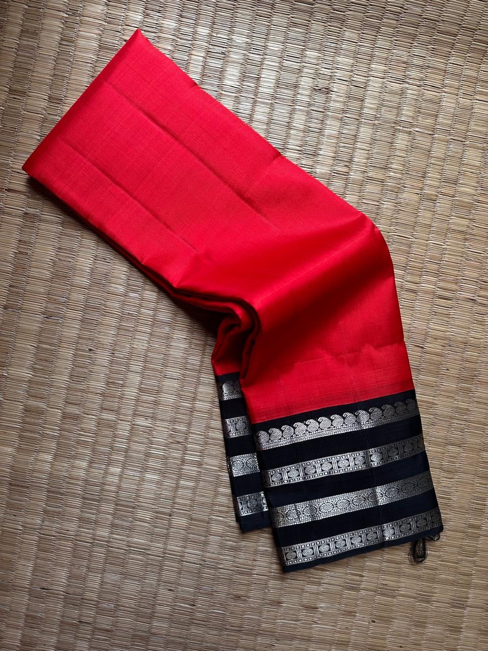 Kohl & Crimson Silk — Pure Kanchipuram Saree
Crimson body with kohl-black silver-zari borders & grand silver pallu
Silk Mark Certified • Free Shipping within USA • Ships in Two Weeks