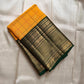 Manjal Pachai Kattam
Pure Kanchipuram Silk Saree – Marigold Yellow Body with Green Checks & Petite Zari Buttas
Deep Green Korvai Borders with Rich Gold Zari Weave & Traditional Elephant Motifs
Silk mark certified , ships in 2 weeks