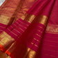 Close-up of pink-red Kanchipuram silk saree pallu featuring dense gold zari weaving and lined body.