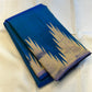 Neelam ettukol 
Pure Kanchipuram Silk Saree – Deep Ocean Blue with Silver Zari Ikat Motifs
Rich 8 Kol Weave for Heavier, Denser & Lustrous Drape
Silver Tissue Pallu with Intricate Brocade Weaving
Includes Matching Blue Blouse Piece with Zari Border