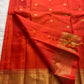 Maya
Vibrant Orange Kanchipuram Silk Saree with Lustrous Gold Coin Buttas
Handwoven Traditional Rudhraksham Seer and Intricate Arai Maadam Zari Border
Richly Crafted Pallu Featuring Elegant Gold Zari Panels for a Regal Finish