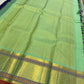 A striking blend of tradition and bold design, this navy blue Kanchipuram silk saree features delicate grid-like checks across the body. What sets it apart is the vibrant mint green and gold zari border, intricately woven with paisley and floral motifs