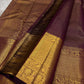 Varnika – Handwoven Kanchipuram Silk Saree in Plum Wine
A regal plum Kanchipuram silk saree adorned with gold zari paisleys and Gandaberunda motifs