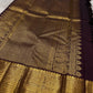 Cholai – Orchard at Dusk ✨ A pure Kanchipuram silk in deep purplish-brown, adorned with regal Gandaberunda 🦅 and delicate Kamalam 🌸 motifs. Its gold zari border layers Varisaipet, mango paisley 🥭, Rudhraksham, and Vanki for a true heritage masterpiece
