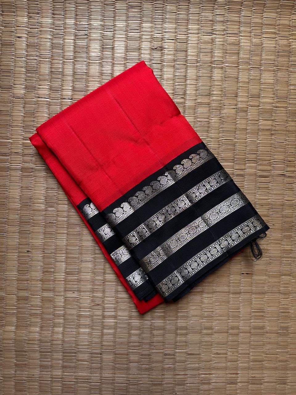 Kohl & Crimson Silk — Pure Kanchipuram Saree
Crimson body with kohl-black silver-zari borders & grand silver pallu
Silk Mark Certified • Free Shipping within USA • Ships in Two Weeks