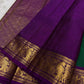 Sorgavaasal Kili – Pure Silk Kanchipuram Saree in Teal with Purple Zari Kattam
Intricately handwoven with traditional zari kattam checks and adorned with exquisite zari-woven Yazhi buttas, this saree features a vibrant teal body paired with a regal purple