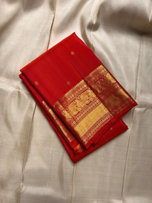 Fiery orange red shot double  color small flower motif with vanasringaram and Rudhraksham border pure silk mark certified Kanchipuram saree