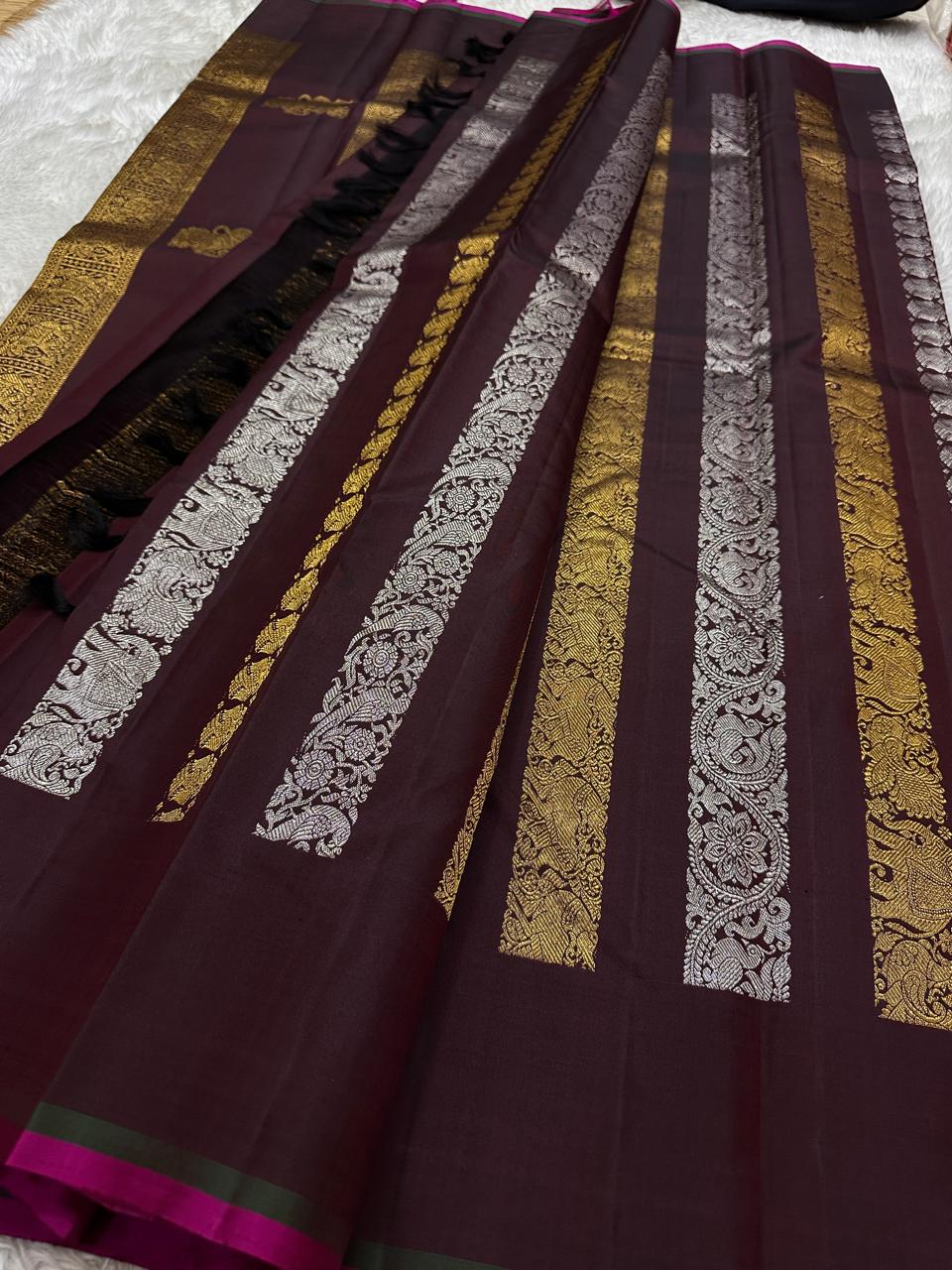 Lavanya– deep brown Handwoven Kanchipuram Silk Saree in Brown with Gold & Silver Zari, this deep brown Kanchipuram silk saree with intricate motifs in gold and silver zari, including Gandaberunda, parrots, elephants &lotuses as seen on Nita Ambani