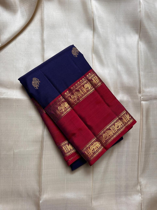 Pure silk kanchipuram deep ink  blue  with red border reaper elephant border , elephant and Gandaberunda butta in zari all over  body