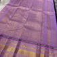 closeup of lavender zari woven border with multicolor stripe on aubergine purple kanchipuram silk saree shipped from New Jersey USA