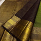 Forest Gold – Pure Kanchipuram Silk Saree
Leaf-green body with fine pin stripes.
Zari leaf buttas for subtle sparkle.
Coffee-maroon korvai border in antique gold.

Silk Mark Certified, delivery in 2 weeks
