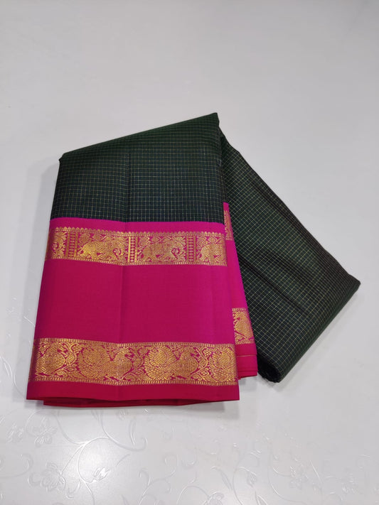 Emerald Fuchsia Zari kattam – Pure Kanchipuram Silk Saree
Zari Kattam Checks All Over the Body ✨
Rani-Pink Rettapet Border with 2G Gold Zari
Grand Brocade Pallu in Contrast Rani-Pink

Silk Mark Certified, delivery in 2 weeks