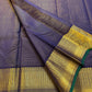 Krishna Shyama — Pure Silk Kanchipuram

Deepest purple “Shyama” body with Vairaoosi pinstripes

Temple-inspired antique gold zari borders with green selvedge

Grand striped zari pallu with hand-tied tassels

Silk Mark Certified • free shipping