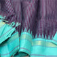 Pure Handwoven Kanchipuram Silk Saree – Deep Aubergine Body with Micro Checks
Contrasting Aqua Blue Korvai Borders with Temple Motifs & silk thread  Stripes
Elegant Striped Aqua seer Pallu
Silk Mark Certified ✅ ships in 2 weeks.