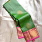 Asha ✨ – Fresh Green Pure Silk Kanchipuram Saree
with Radiant Pink Korvai Contrast Border
Gold Zari Floral Medallion Buttas on the Body
Grand Pink Brocade Pallu with Intricate Weaving