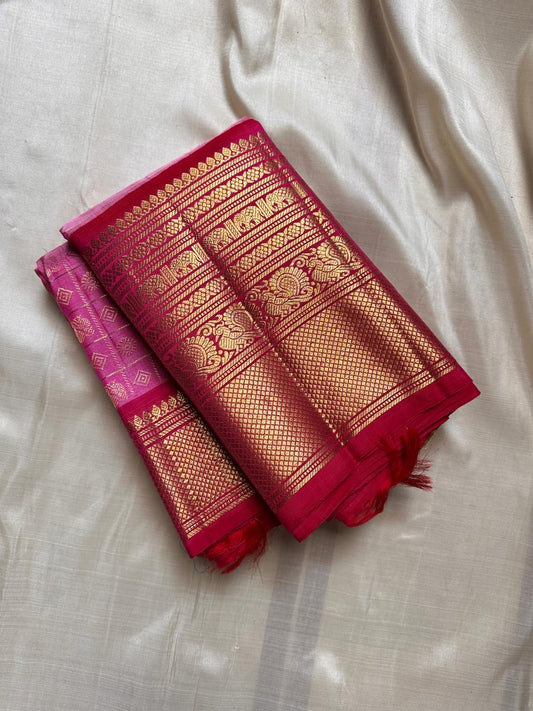 Pure silk Zari kattam butta pink and red saree with peacock, kamalam and kolam motifs