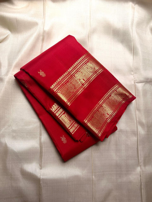 Soma - Drenched in the richness of crimson , woven with pride - Gandaberunda motifs all over body rettapettu border with vanasringaram motifs