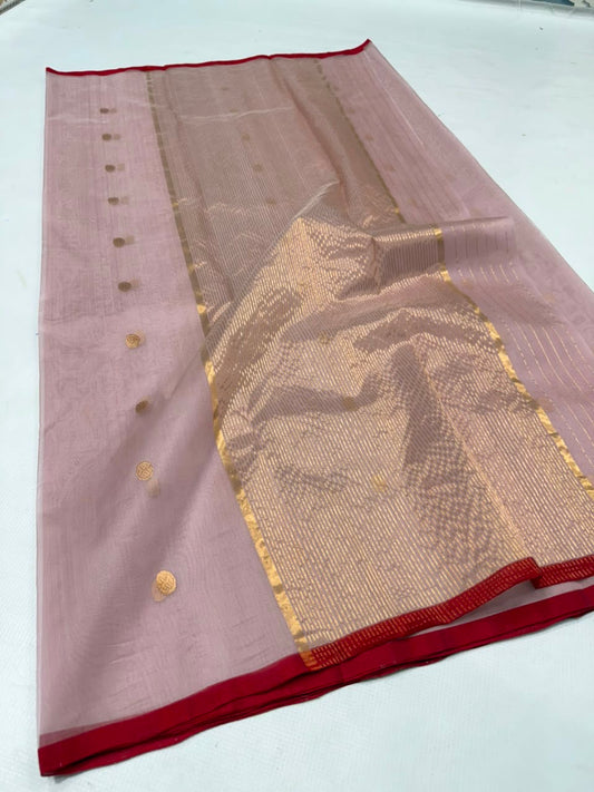 Folded Dusty Rose Chanderi saree showing the gold buttas and red contrast border
