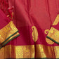 Ushas, Deep Arakku Red Pure Kanchipuram Silk Saree
Radiant Oosi Kattam body with ornate Paisley 2gm Zari
Vanasringaram,Muthuseer,Kamalam border with Fishpettu detailing
Exquisite diamond-pet grid Zari pallu, richly finished with a bold deep green selvedge