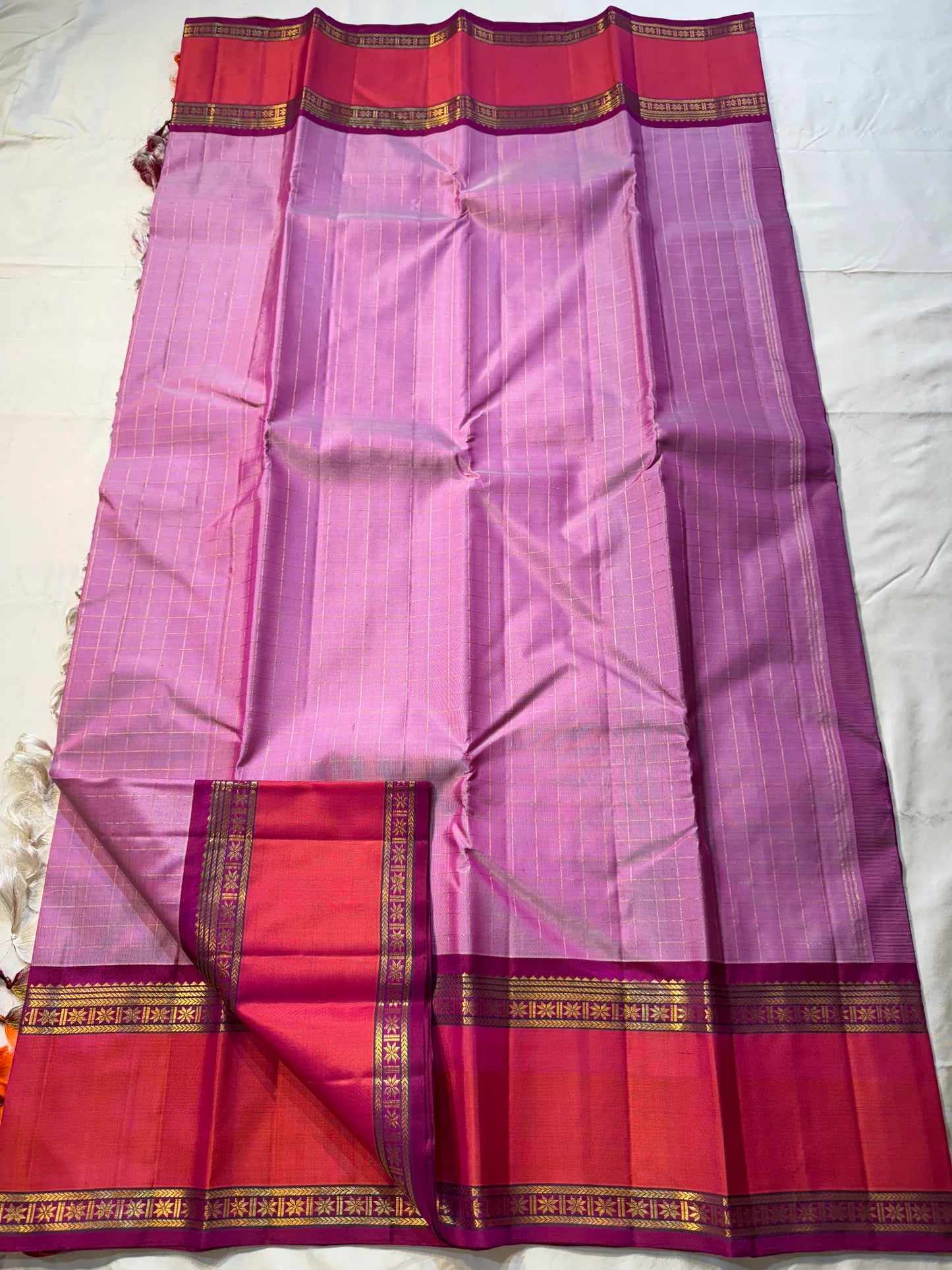 Gulabi Kattam – Pure Kanchipuram Silk Saree
Pastel Pink Body with Fine Zari Grid Checks
Raspberry Korvai Borders with Floral Zari Work
Grand Raspberry–Magenta Brocade Pallu
Silk Mark Certified | Fall & Pico Done | | ships in 2 weeks