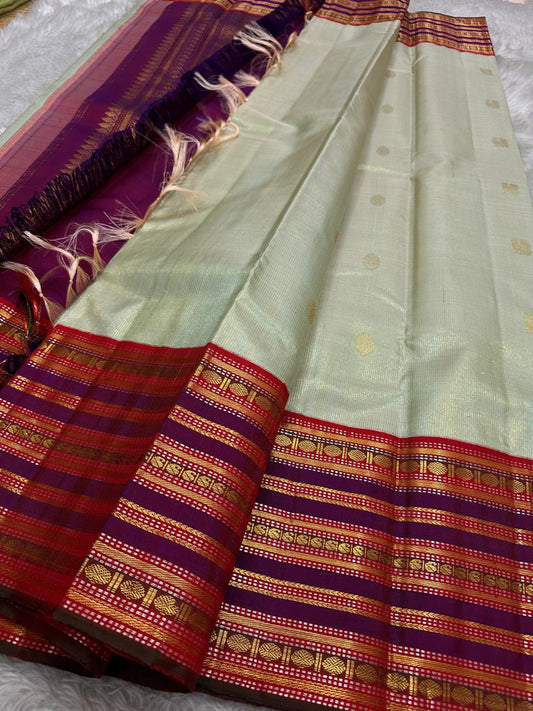 Pure silk kanchipuram grey with sampanga green vairaoosi with detailed ornate varisaipet border thandavalam zari , mayil Butta