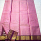 Rose Mist Zari Kattam — Kanchipuram Pure Silk

Blush rose-pink body with micro kattam (checks) in zari & scattered soorya-chakram buttas

Contrast mulberry purple korvai borders with rich gold zari detailing

Free shipping within USA silk mark certified