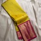 Crafted from pure Kanchipuram silk, this golden yellow saree features a broad pink border with traditional Yali motifs. The pallu is richly woven with bold elephant designs in thick zari—an elegant blend of heritage and grandeur.