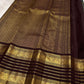Coffee brown body detail showing the dense diagonal zari weave.