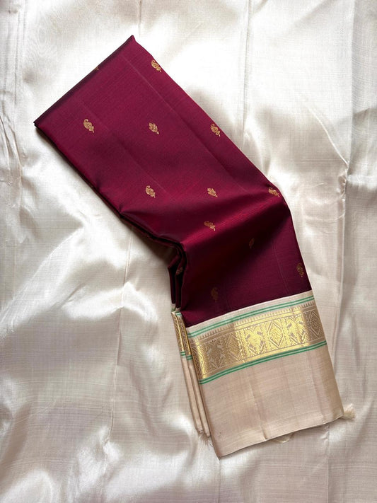 Maroon  Pure Kanchipuram Silk Saree with Kaal Erangina ivory  Zari Border