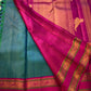 Kavi ✨ – Pure Kanchipuram Silk Saree
Teal Blue Silk Body with Lustrous Shot Weave
Rich Magenta Contrast Border in Gold Zari
Grand Pallu with Intricate Kili (Parrot) Motifs
Magenta Blouse with Matching Zari Border Silk Mark Certified, delivery in 2 weeks